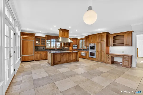 a bathroom with a sink a mirror and a window