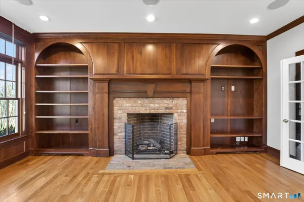 a view of staircase with white walls and a window