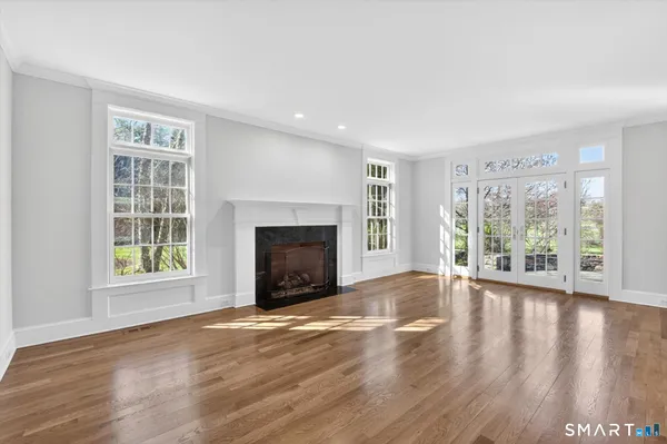 a spacious bathroom with a granite countertop tub sink and mirror