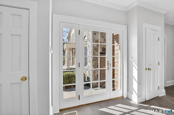 a spacious bathroom with a toilet sink and mirror