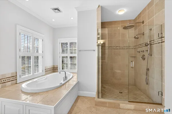 a bathroom with a glass shower door