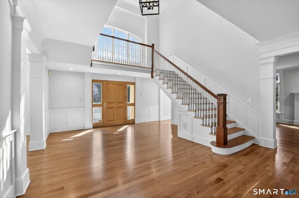 a view of a kitchen with kitchen island granite countertop a large counter top and outdoor seating
