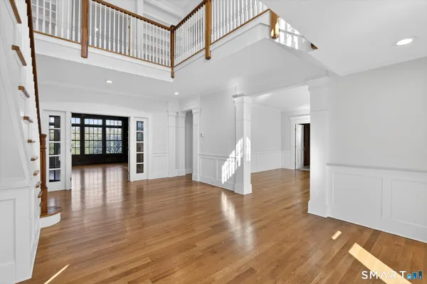 a view of an empty room with a kitchen