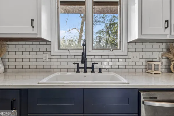 a bathroom with a sink and a window