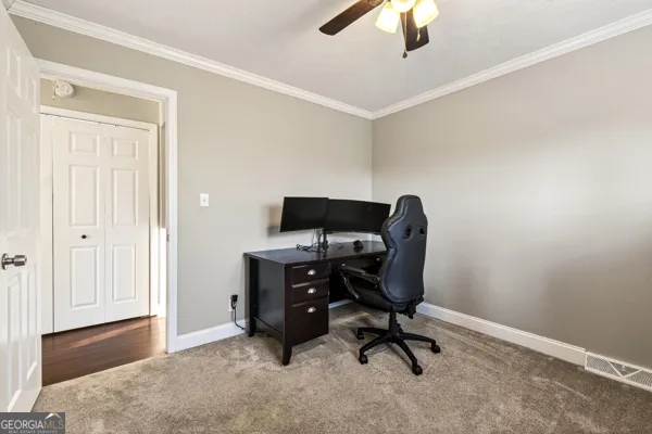 a view of a workspace with furniture