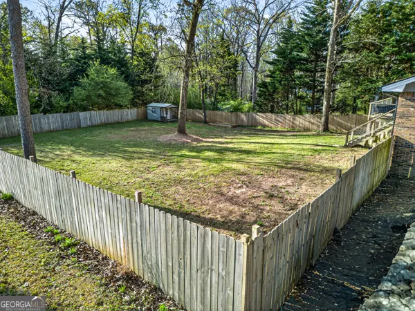 a view of a backyard with trees