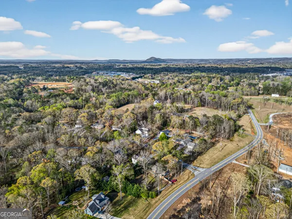 a view of a house with a tree