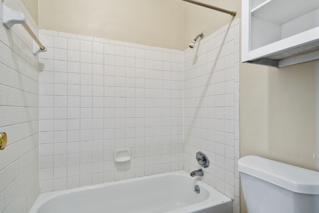 12166 Metric Boulevard, Unit 1013 Austin, TX 78758 - Photo 11 of 16 Bathroom featuring tub / shower combination and toilet