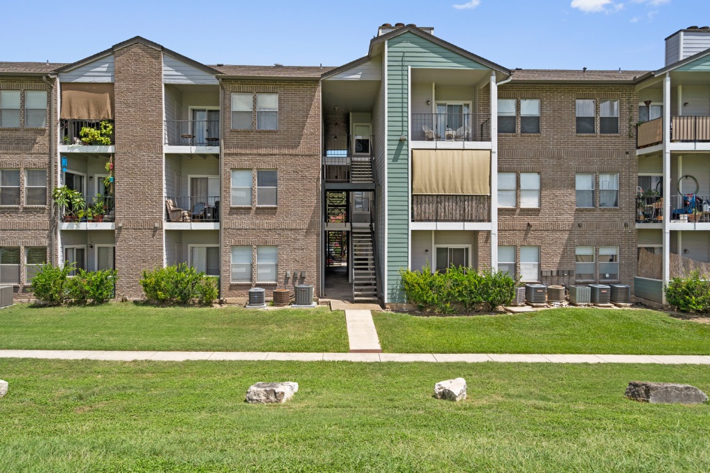 12166 Metric Boulevard, Unit 1013 Austin, TX 78758 - Photo 2 of 16 View of apartment building / complex with stairway