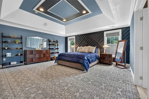 a bedroom with a bed and a walk in closet