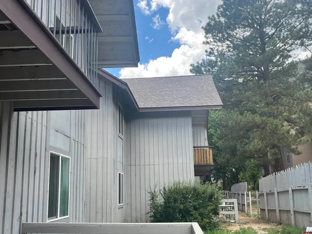 a view of a town with mountains in the background