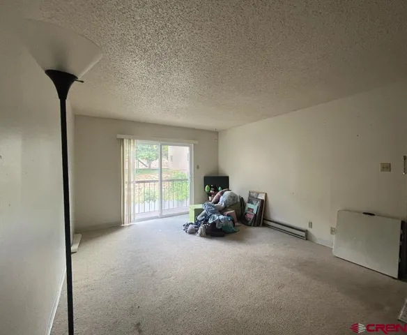 a kitchen with stainless steel appliances granite countertop a refrigerator and a stove