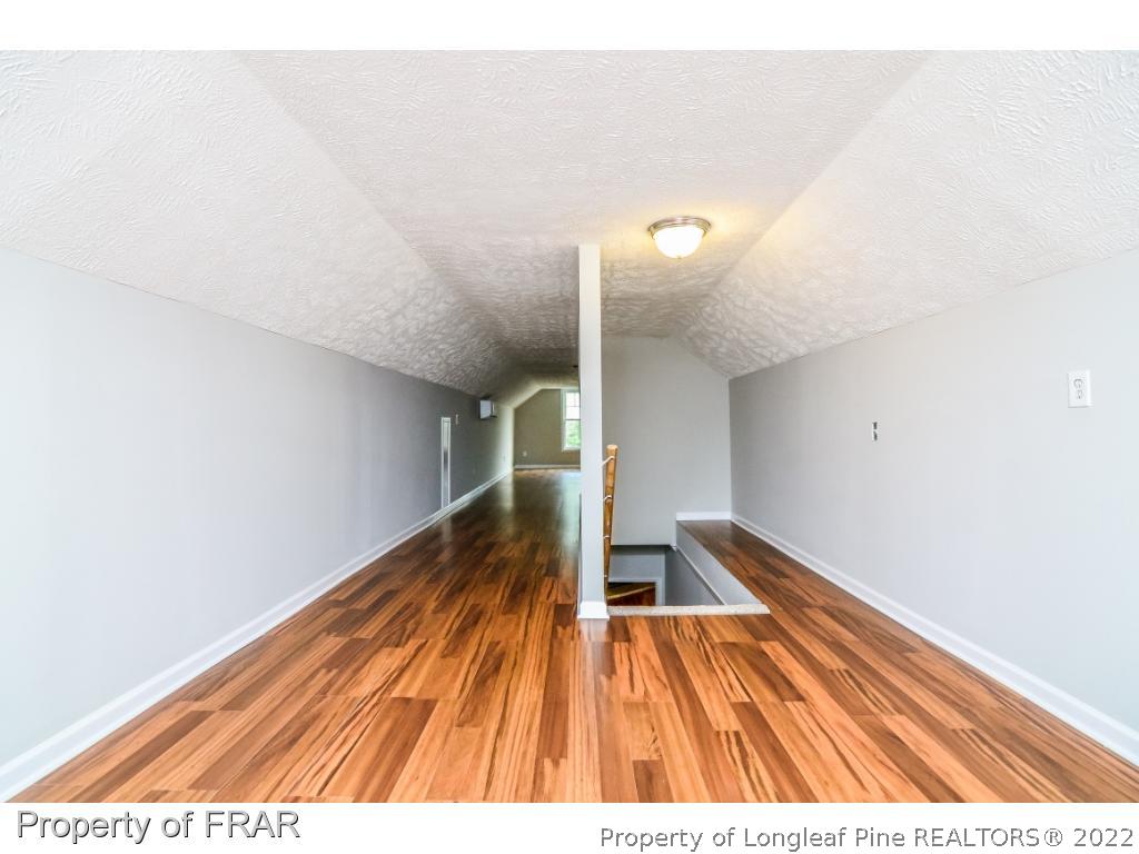 7347 Maxwell Road Stedman, NC 28391 - Photo 23 of 28 a view of wooden floor in a room