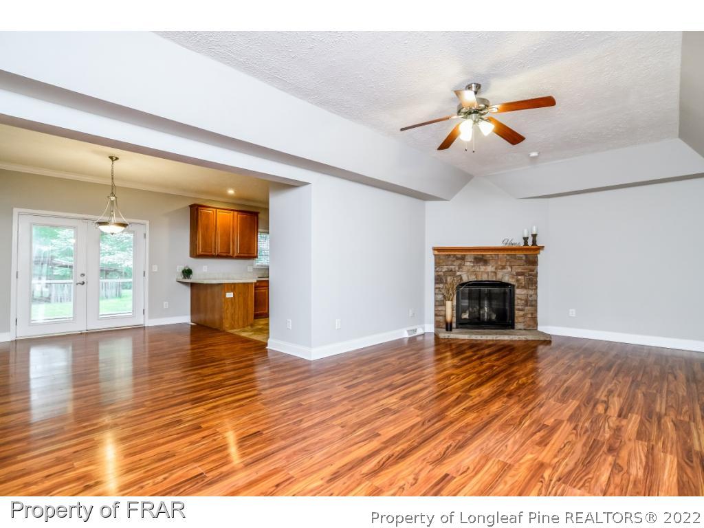 7347 Maxwell Road Stedman, NC 28391 - Photo 3 of 28 a view of empty room with wooden floor and fan
