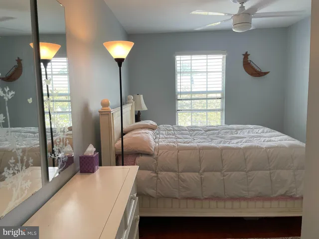 a bedroom with a bed and a lamp
