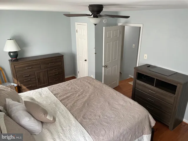 a bedroom with a bed and a dresser
