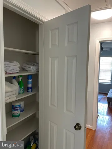 a view of room with window and wooden floor