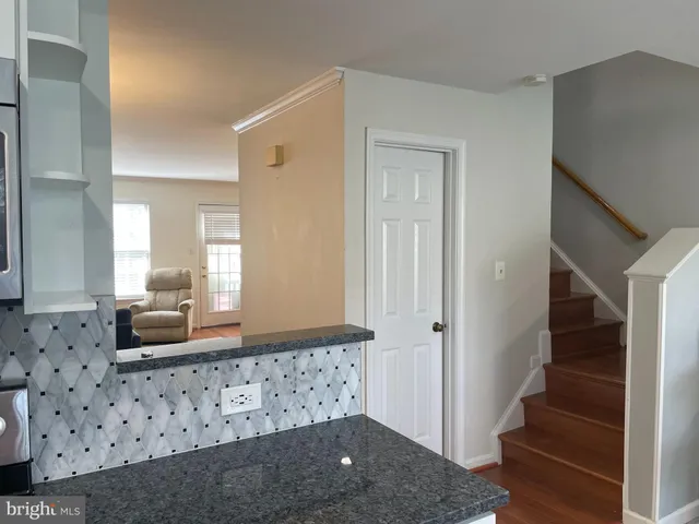 a bathroom with mirror and window