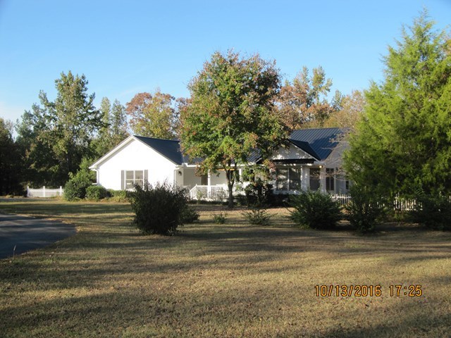 1748 Fred Hall Road Gordon, GA 31031 - Photo 1 of 28 a view of street with houses