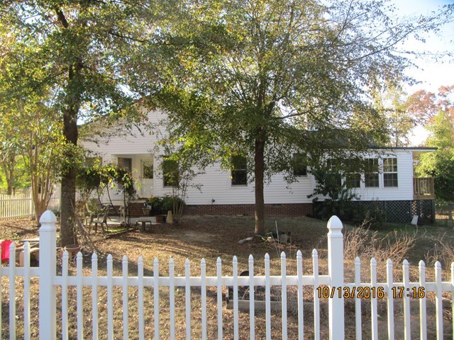 1748 Fred Hall Road Gordon, GA 31031 - Photo 13 of 28 a front view of a house with a yard