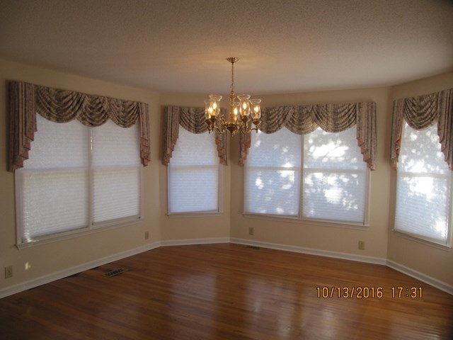 1748 Fred Hall Road Gordon, GA 31031 - Photo 18 of 28 a view of a room with wooden floor and windows