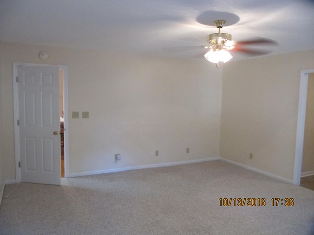 1748 Fred Hall Road Gordon, GA 31031 - Photo 19 of 28 an empty room with a view of bathroom