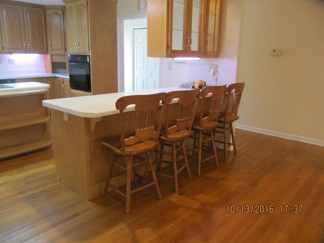 1748 Fred Hall Road Gordon, GA 31031 - Photo 23 of 28 a view of a dining room with furniture and wooden floor