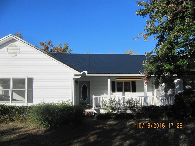 1748 Fred Hall Road Gordon, GA 31031 - Photo 26 of 28 a front view of a house with a yard