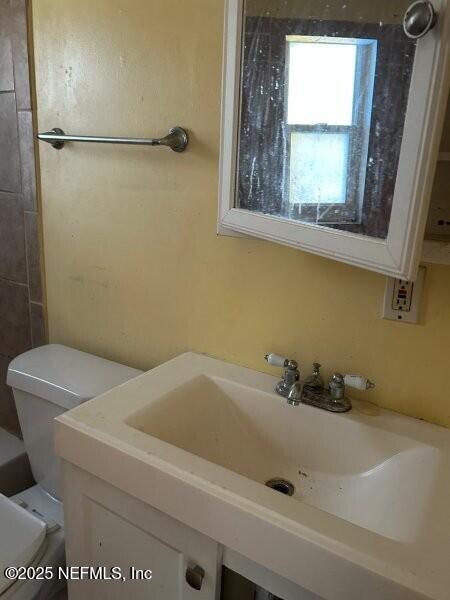 4117 Santee Road Jacksonville, FL 32209 - Photo 13 of 47 a bathroom with a sink and a vanity