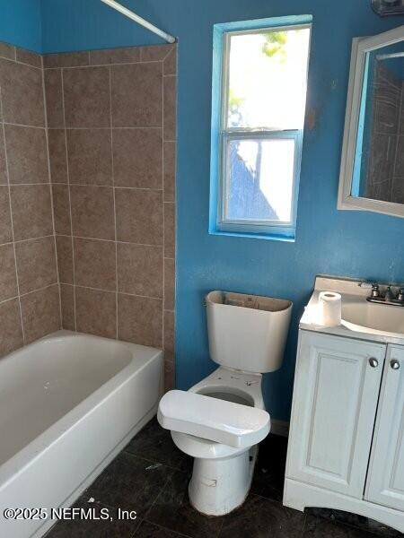 4117 Santee Road Jacksonville, FL 32209 - Photo 19 of 47 a bathroom with a toilet a sink and a bathtub