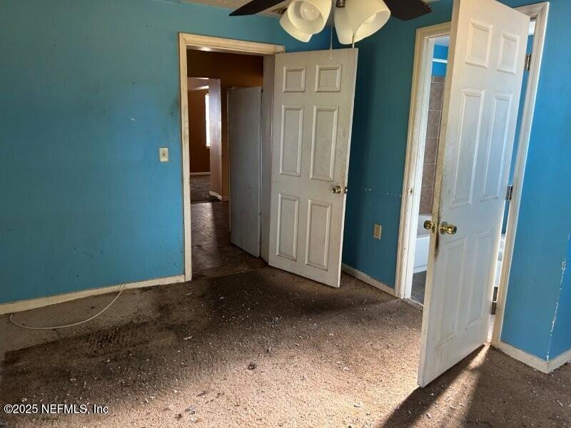 4117 Santee Road Jacksonville, FL 32209 - Photo 20 of 47 a view of a hallway with wooden shelves