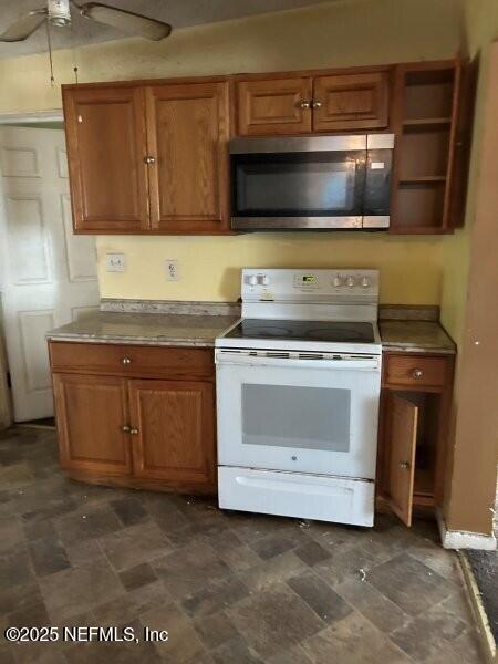 4117 Santee Road Jacksonville, FL 32209 - Photo 4 of 47 a kitchen with a stove and a microwave