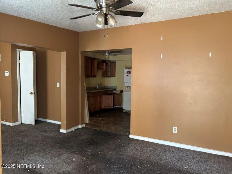 4117 Santee Road Jacksonville, FL 32209 - Photo 9 of 47 an empty room with closet and a ceiling fan