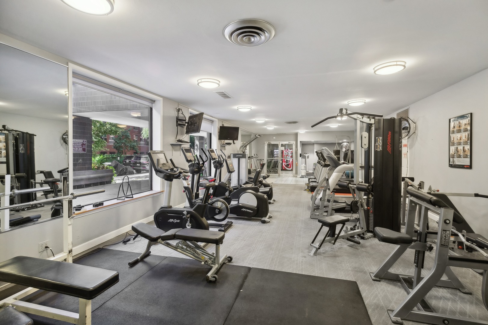 720 West Gordon Terrace, Unit 7G Chicago, IL 60613 - Photo 3 of 4 a view of a room with gym equipment