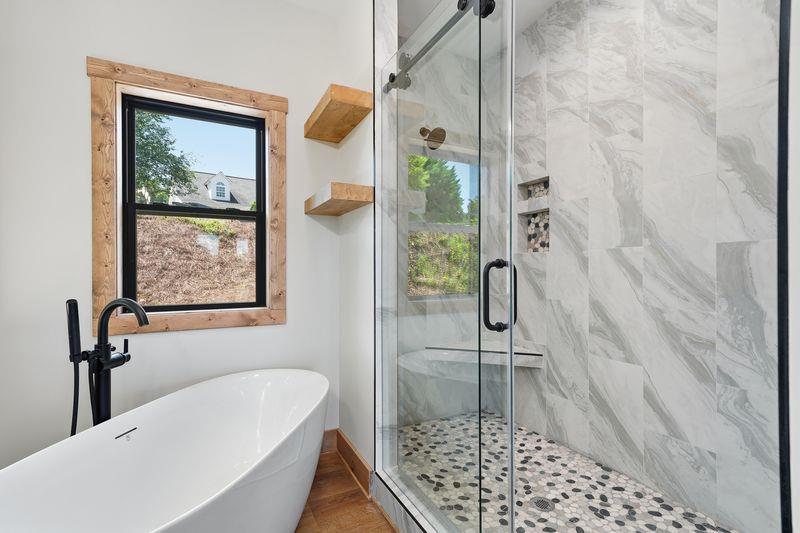 216 Old Orchard Road Ellijay, GA 30536 - Photo 37 of 59 a bathroom with a bathtub and shower