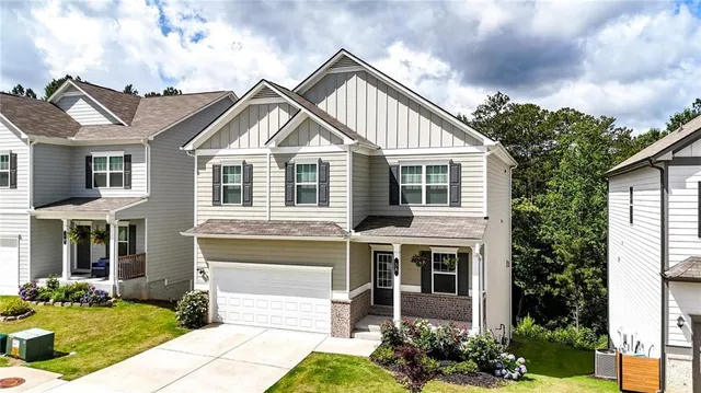 a front view of a house with garden