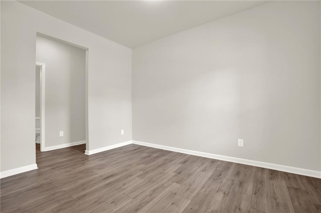 56 Preserve Point Jasper, GA 30143 - Photo 11 of 49 a view of an empty room with wooden floor