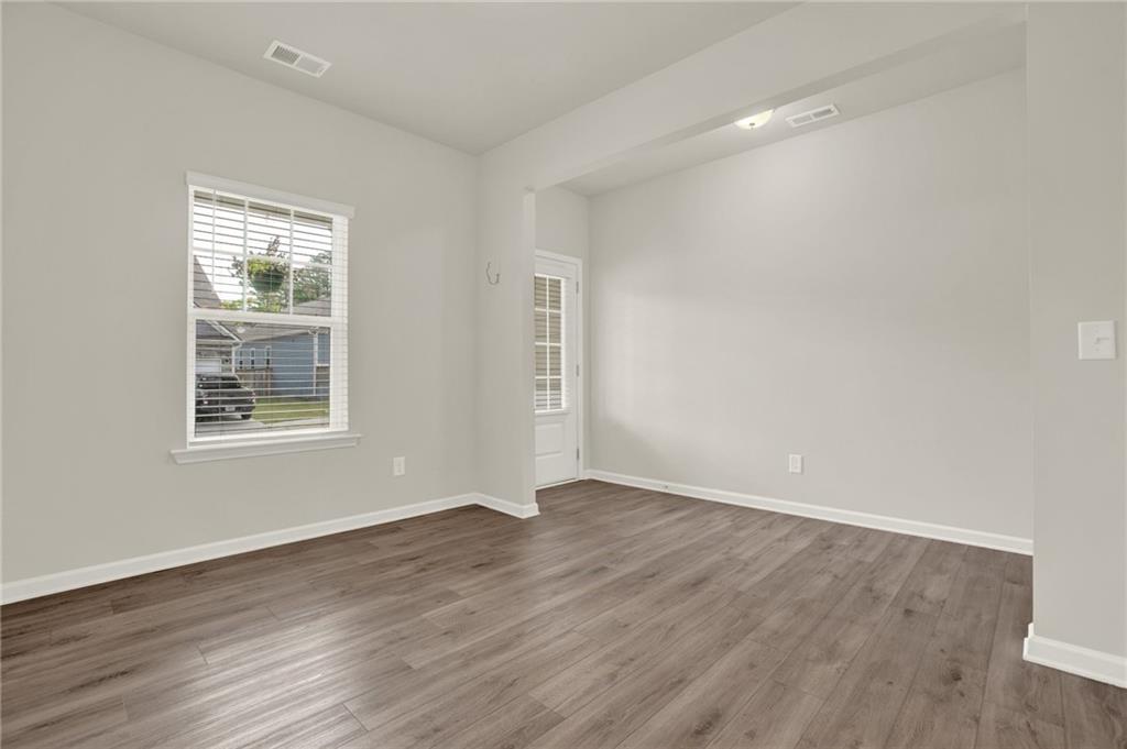 56 Preserve Point Jasper, GA 30143 - Photo 12 of 49 a view of an empty room with wooden floor and a window