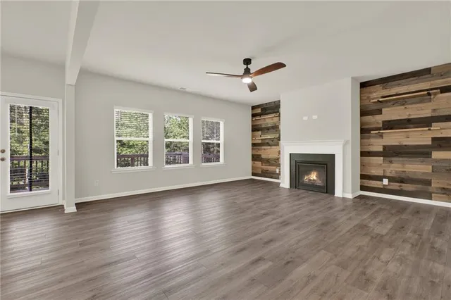 a view of kitchen and hall with wooden floor