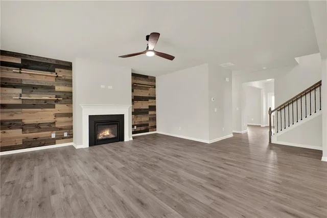 a large kitchen with stainless steel appliances lots of counter space and a sink