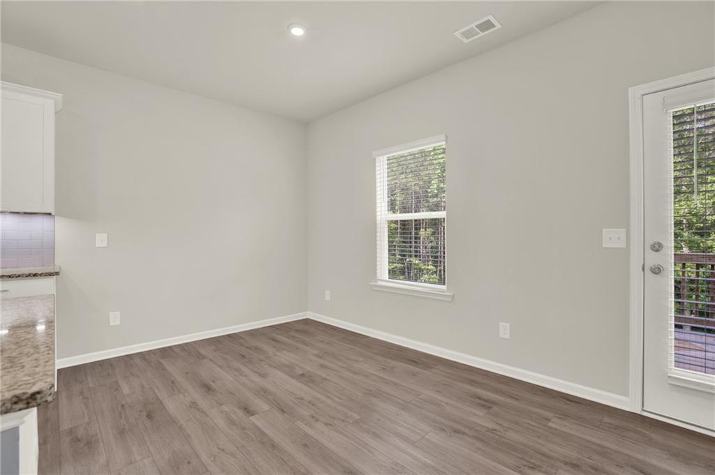 56 Preserve Point Jasper, GA 30143 - Photo 20 of 49 an empty room with wooden floor and windows