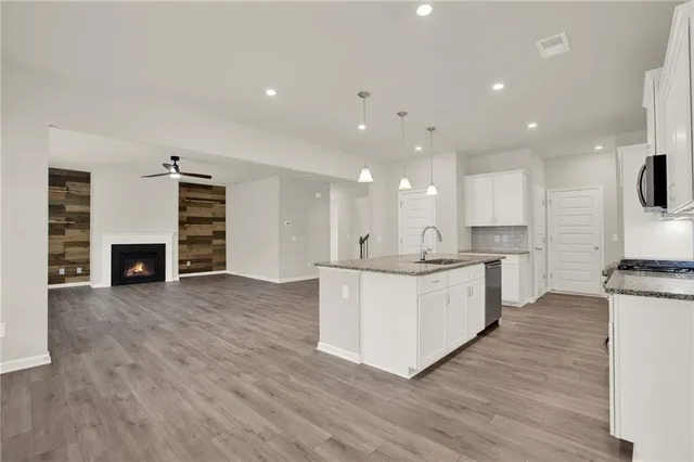 a kitchen with granite countertop white cabinets and a granite counter tops