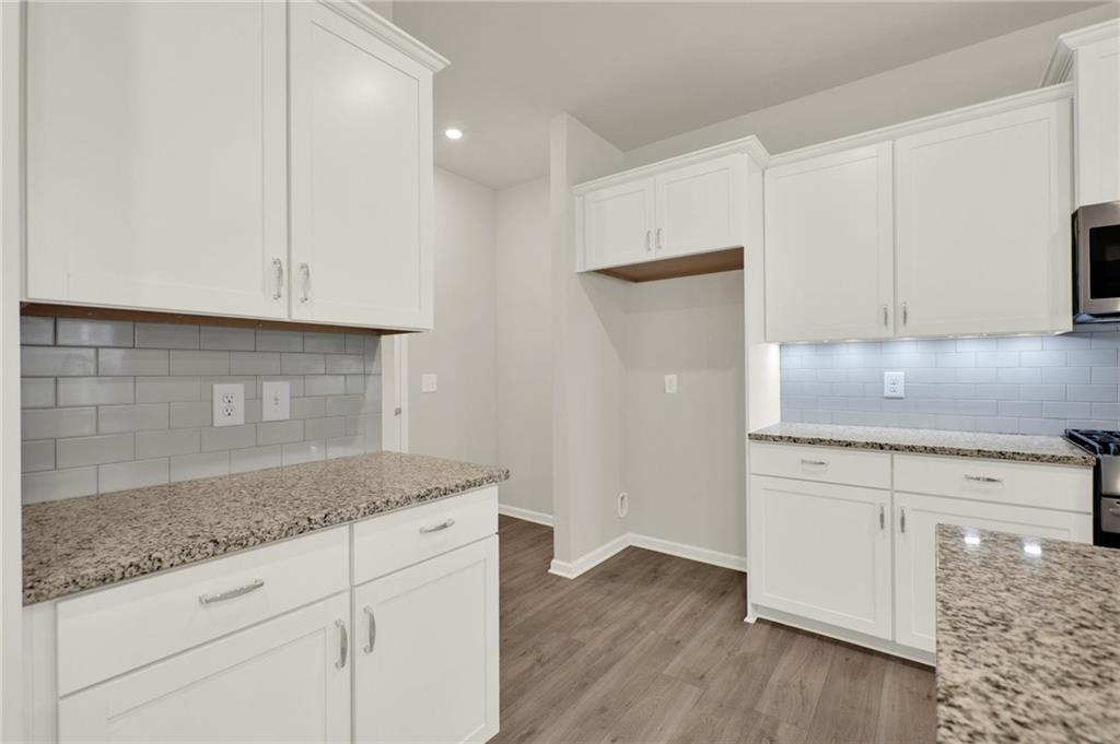 56 Preserve Point Jasper, GA 30143 - Photo 22 of 49 a kitchen with granite countertop white cabinets and a granite counter tops
