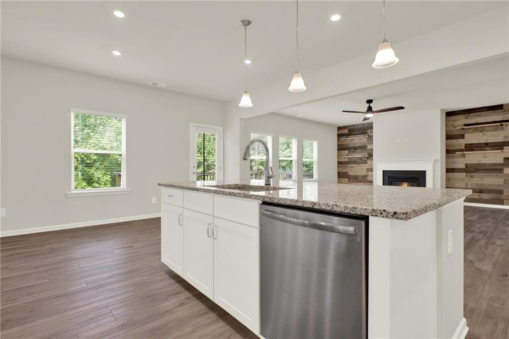 56 Preserve Point Jasper, GA 30143 - Photo 24 of 49 a kitchen with stainless steel appliances granite countertop a sink a stove and a wooden floors
