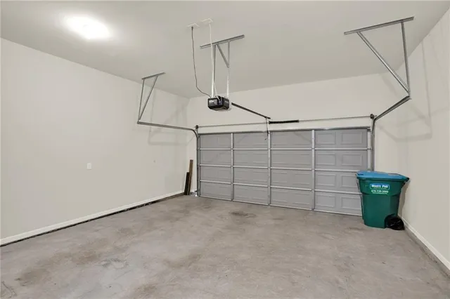 a view of staircase with wooden floor and white walls