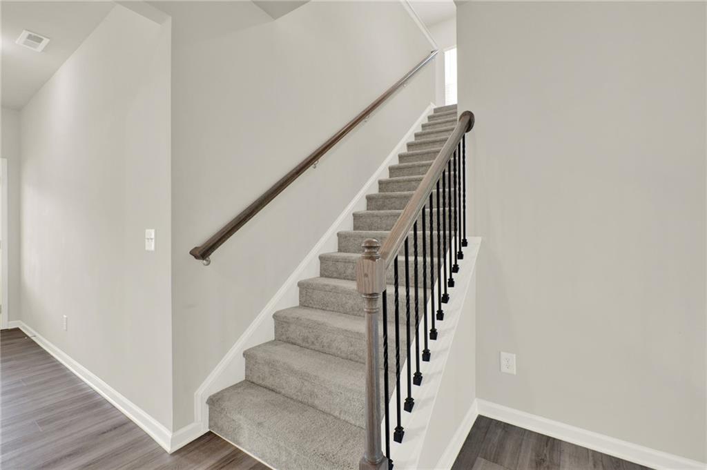 56 Preserve Point Jasper, GA 30143 - Photo 28 of 49 a view of staircase with wooden floor and white walls