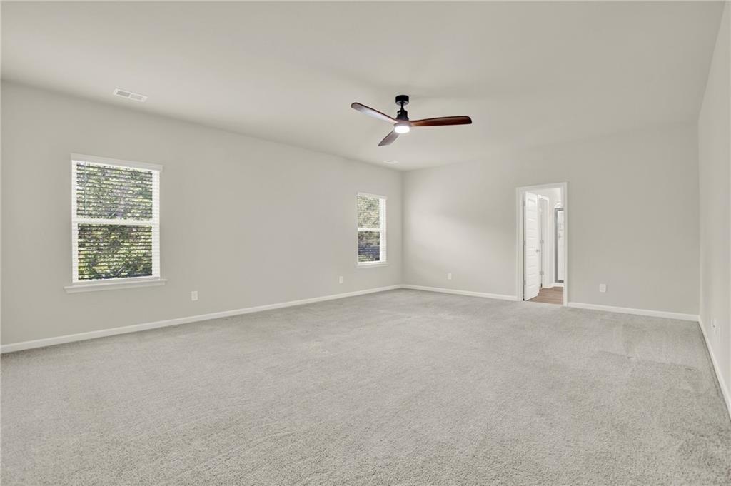 56 Preserve Point Jasper, GA 30143 - Photo 30 of 49 an empty room with windows and ceiling fan