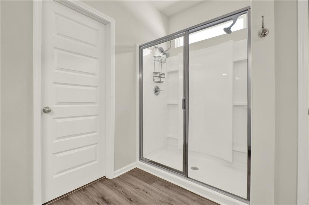 56 Preserve Point Jasper, GA 30143 - Photo 34 of 49 a bathroom with a glass shower door
