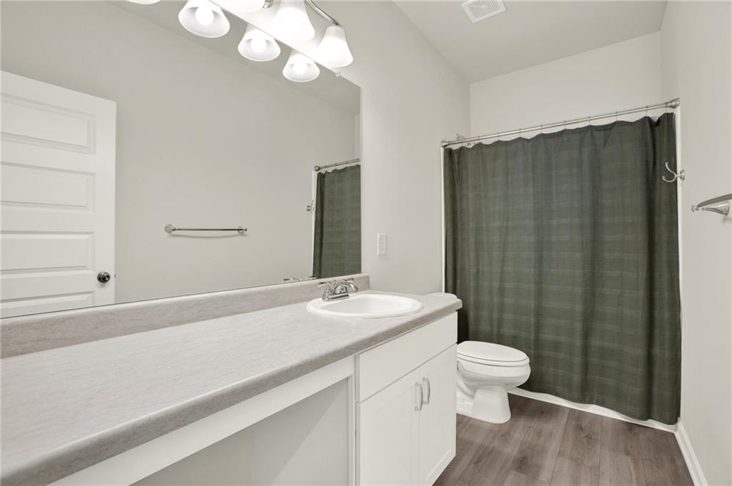 56 Preserve Point Jasper, GA 30143 - Photo 43 of 49 a bathroom with a sink a toilet and a large mirror