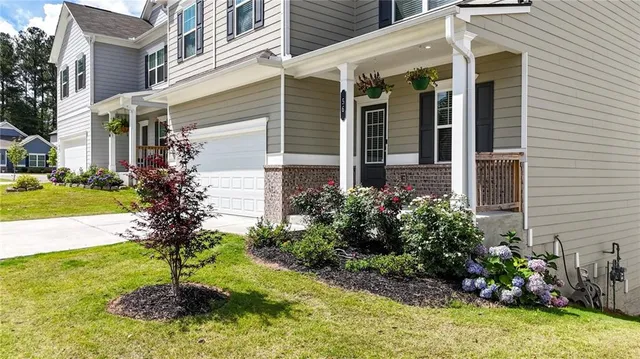 a front view of a house with garden